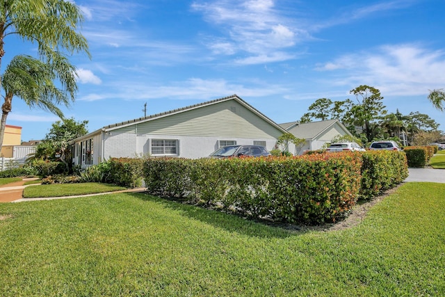 2109 SE Wayne Rd Unit 2109, Stuart, FL 34994 - view of property exterior with a lawn