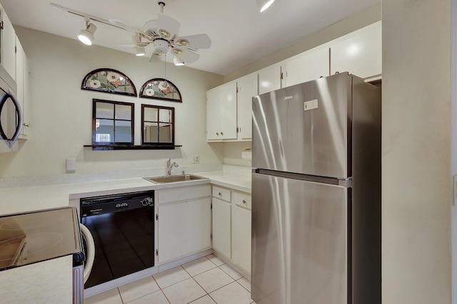 kitchen with black dishwasher, stainless steel fridge, white cabinetry, and sink