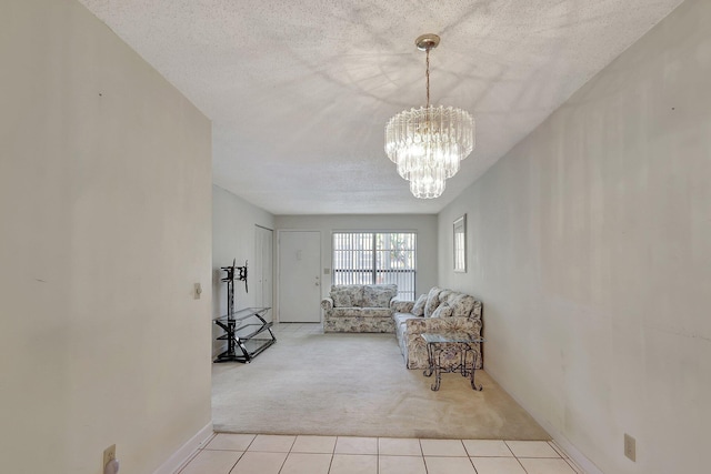 living room with light carpet, a textured ceiling, and a chandelier