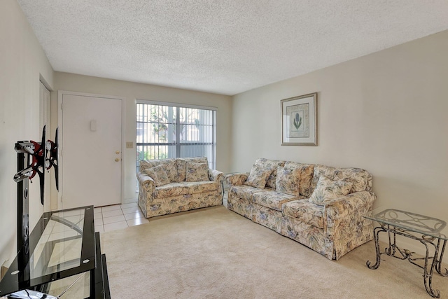 carpeted living room with a textured ceiling