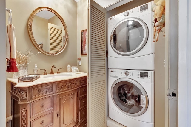 washroom with stacked washer / dryer and sink