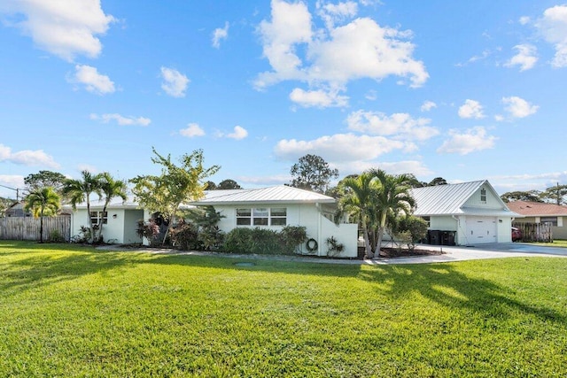 single story home featuring a front yard and a garage