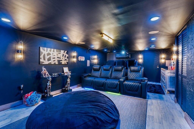 home theater room featuring hardwood / wood-style flooring