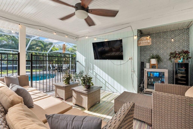 exterior space with a pool, ceiling fan, wooden ceiling, and beverage cooler