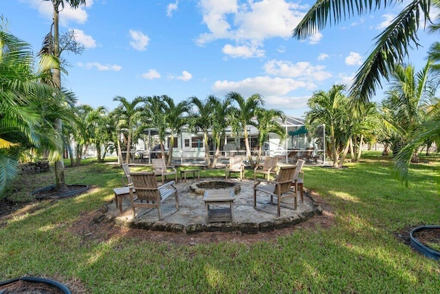 view of yard featuring a patio and a fire pit