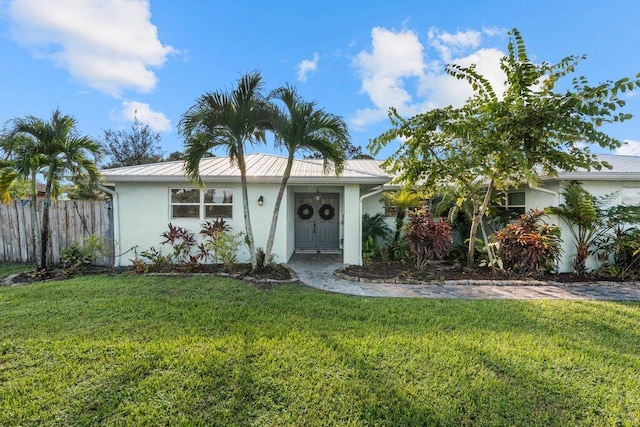 ranch-style home featuring a front yard