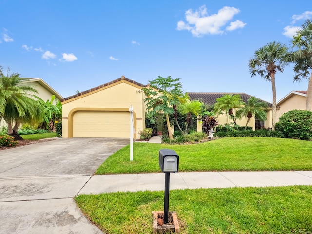 mediterranean / spanish-style house featuring a front lawn and a garage