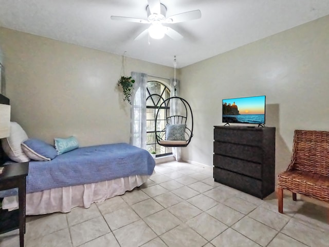 bedroom featuring light tile patterned floors and ceiling fan