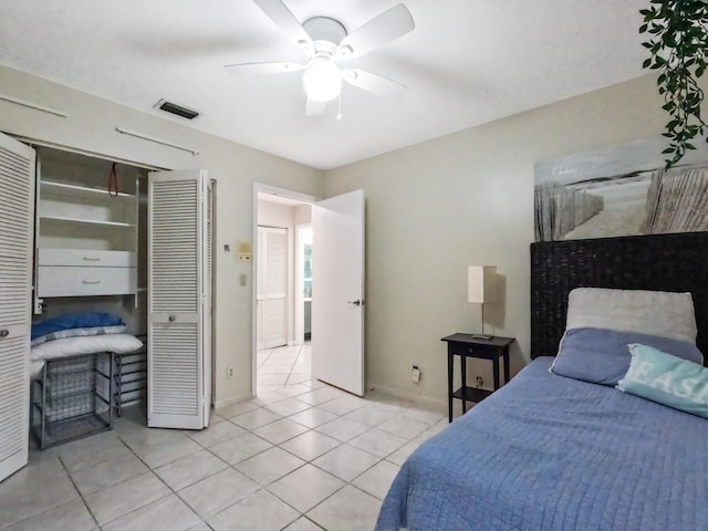 tiled bedroom featuring a closet and ceiling fan