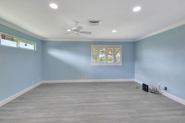 unfurnished room featuring crown molding, light hardwood / wood-style flooring, and ceiling fan