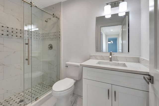 bathroom featuring vanity, toilet, and an enclosed shower