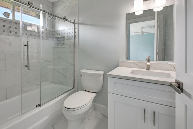 full bathroom featuring toilet, combined bath / shower with glass door, vanity, and ceiling fan