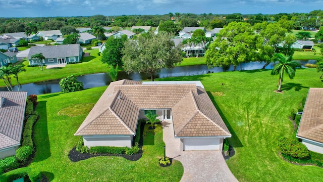 birds eye view of property with a water view