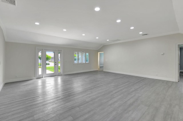 unfurnished room with ornamental molding and light wood-type flooring