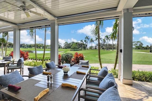 view of patio / terrace featuring a water view, ceiling fan, and an outdoor hangout area