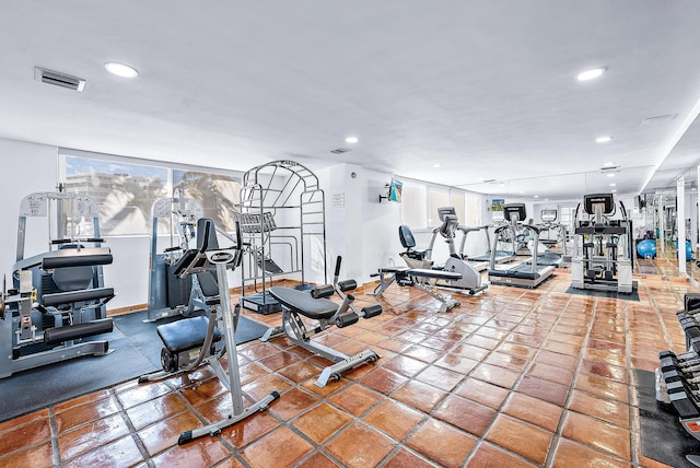 gym with a wealth of natural light and tile patterned floors