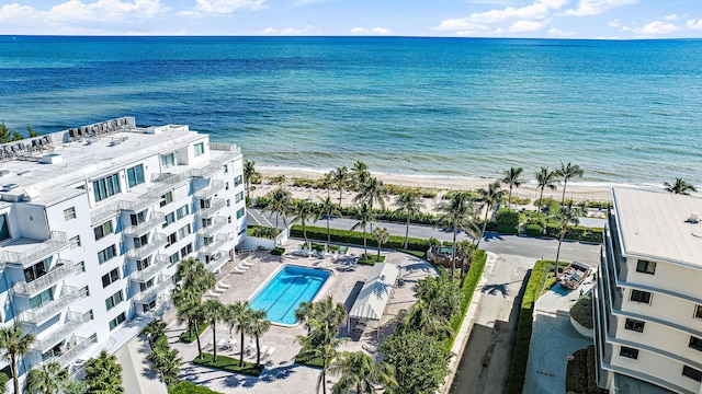 drone / aerial view with a water view and a view of the beach