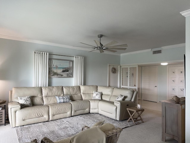 living room with ceiling fan, crown molding, and light carpet