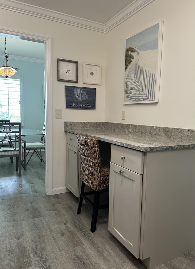 office area with crown molding and wood-type flooring