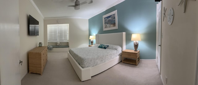 bedroom with light carpet, ceiling fan, and crown molding