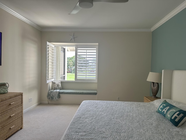 bedroom featuring ceiling fan, light colored carpet, and crown molding