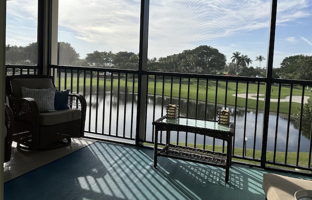 balcony featuring a water view