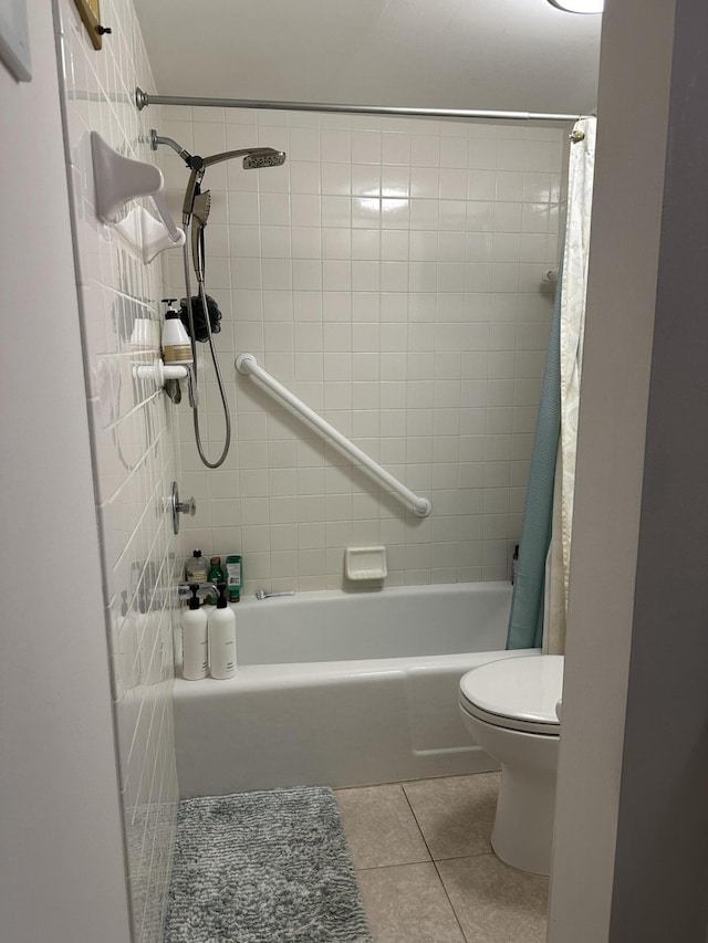 bathroom with shower / bath combo with shower curtain, tile patterned flooring, and toilet