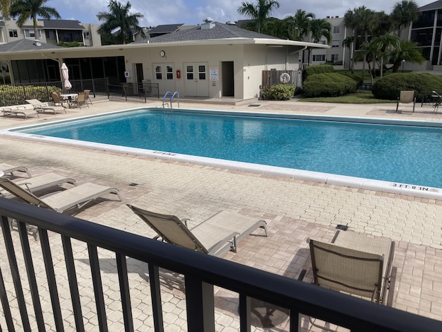 view of swimming pool featuring a patio area