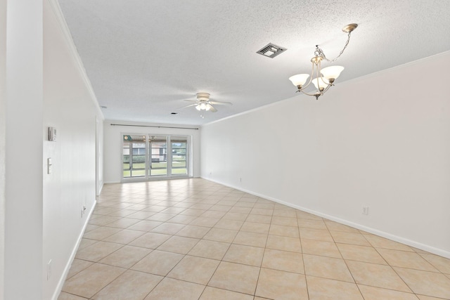 unfurnished room with ornamental molding, a textured ceiling, ceiling fan with notable chandelier, and light tile patterned floors