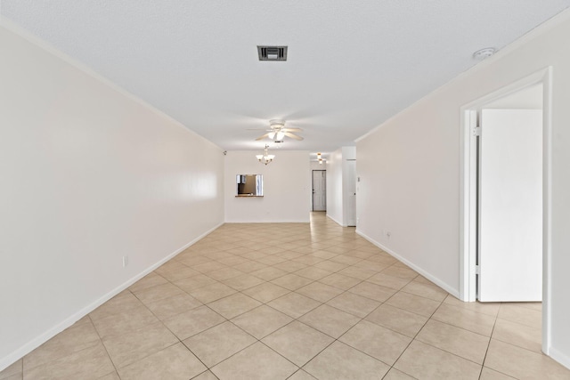 spare room featuring light tile patterned floors and ceiling fan