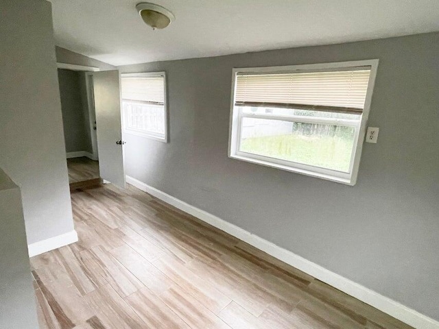 spare room with light hardwood / wood-style floors