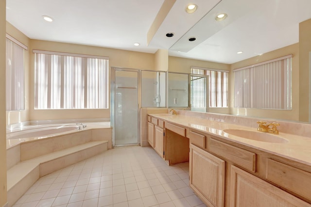 bathroom with vanity, independent shower and bath, and tile patterned flooring