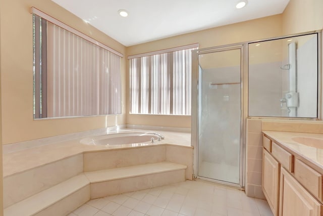 bathroom with vanity, independent shower and bath, and tile patterned floors