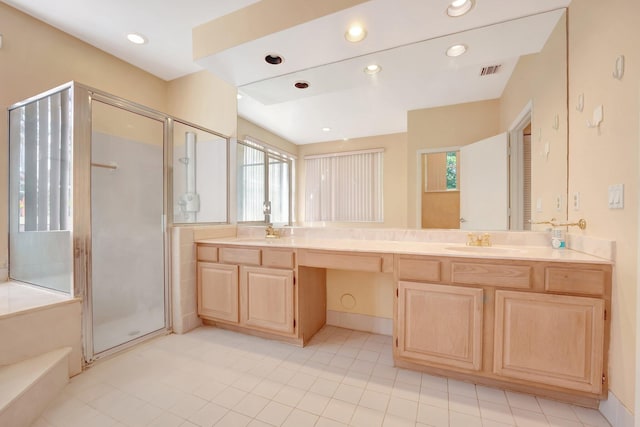 bathroom featuring vanity, tile patterned flooring, and an enclosed shower