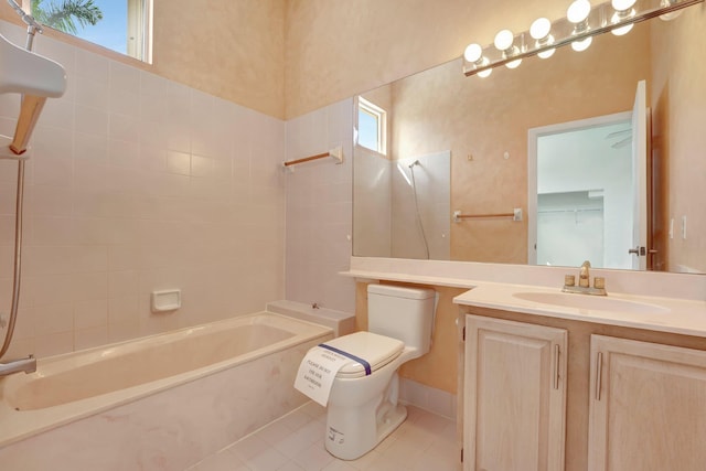 full bathroom with vanity, tile patterned flooring, toilet, and plenty of natural light