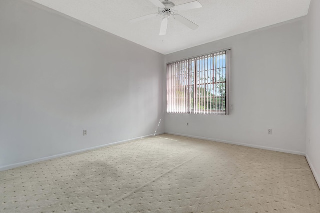 unfurnished room with ceiling fan, lofted ceiling, and light colored carpet