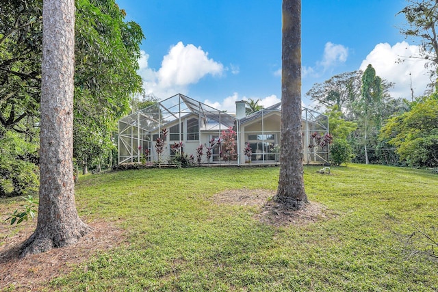 view of yard with a lanai