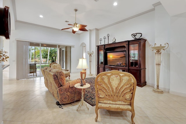 living room featuring ceiling fan, ornamental molding, and light tile patterned floors