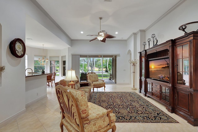 tiled living room featuring ornamental molding and ceiling fan with notable chandelier