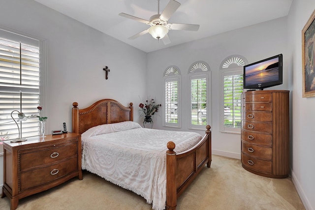 bedroom with light carpet and ceiling fan