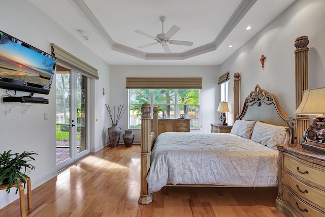 bedroom with light hardwood / wood-style flooring, multiple windows, access to outside, and ceiling fan