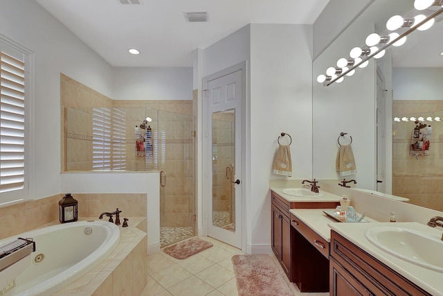 bathroom featuring vanity, tile patterned floors, and shower with separate bathtub