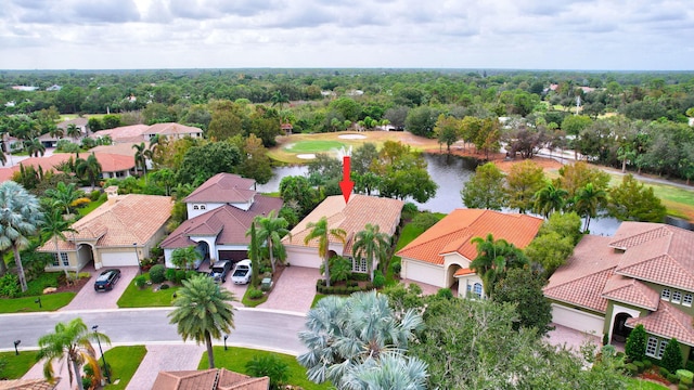 birds eye view of property with a water view