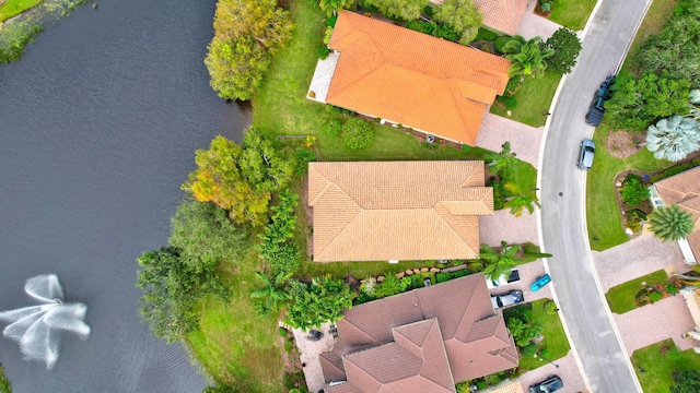 birds eye view of property featuring a water view