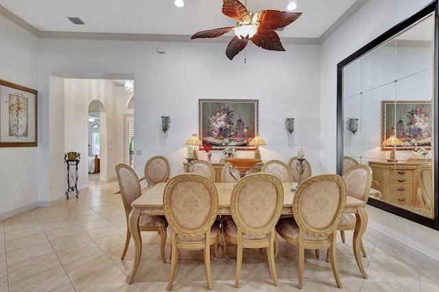 dining space featuring ornamental molding, light tile patterned floors, and ceiling fan