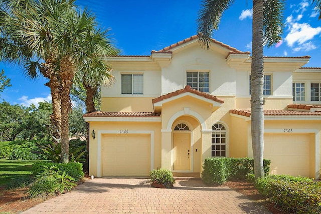 mediterranean / spanish-style home featuring a garage