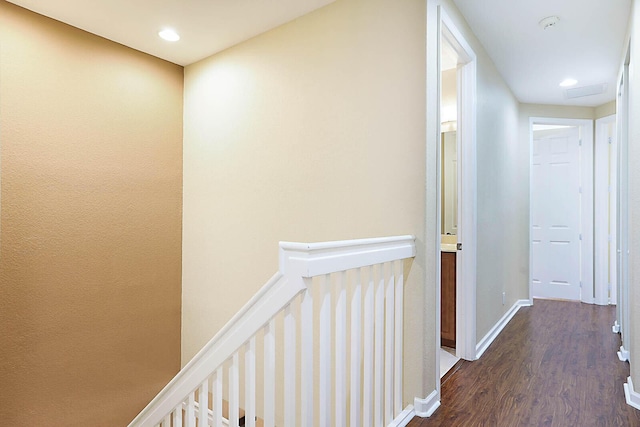 hall with dark wood-type flooring