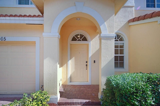 doorway to property featuring a garage