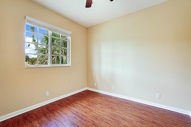 unfurnished room with ceiling fan and wood-type flooring