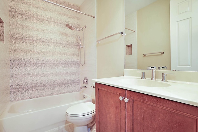 full bathroom with toilet, vanity, and bathing tub / shower combination